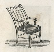 a chair with a carved back